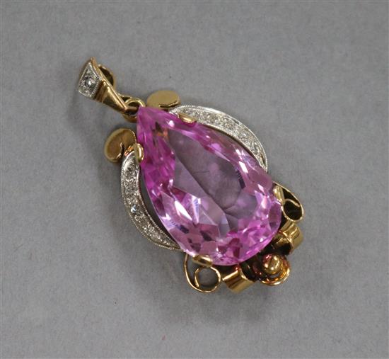 A yellow metal, pear shaped pink synthetic sapphire and diamond set pendant, overall 37mm.
